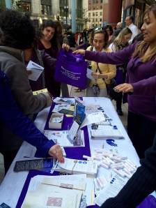 Advocates from the Chicago Metropolitan Battered Women’s Network passed out information at a recent Domestic Violence Awareness Month kick-off rally in downtown Chicago. This October, advocates are highlighting the issue of financial abuse. 